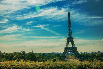 Fototapeta premium Seine River, Eiffel Tower and greenery seen from the Trocadero in Paris. Known as the “City of Light”, is one of the most impressive world’s cultural center. Northern France. Retouched photo.