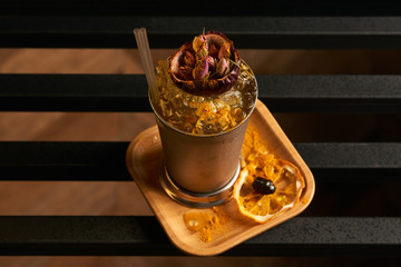 Mariachi cocktail on bar table. Freshness alcoholic beverage drink with Tequila, Luxardo, Grapefruit juice, Kurkuma syrup, Egg white ingridients, close-up.  Tart cocktail refreshing with citrus flavor