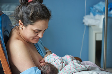 Latina mom breast feeding baby