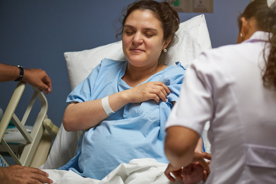Nurse checking young woman helth