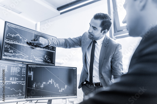 businessmen trading stocks online stock brokers looking at graphs stock brokers