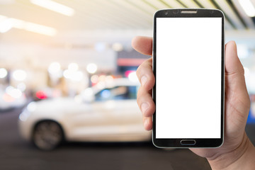 mockup display mobile phone in hand with blurred  modern car background