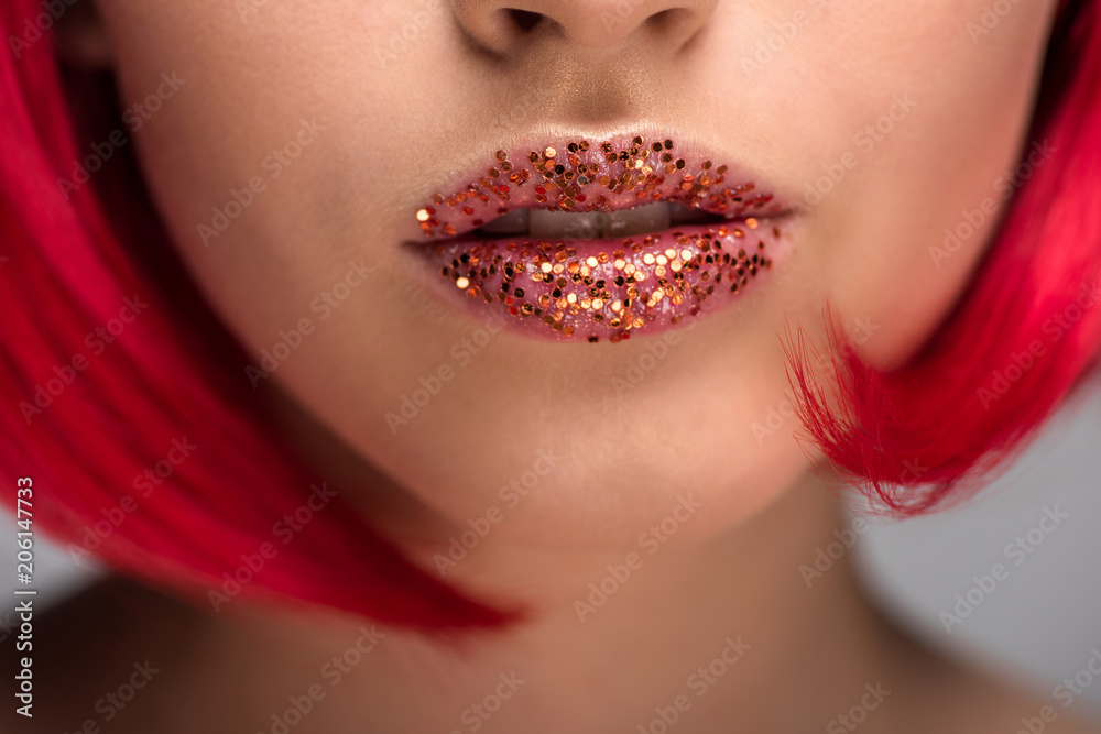 Wall mural cropped image of woman with red hair and glitter on lips