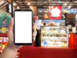 Fototapeta na wymiar mockup display mobile phone in hand with blurred background