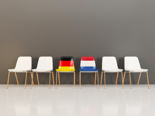 Chairs with flag of Germany and netherlands in a row