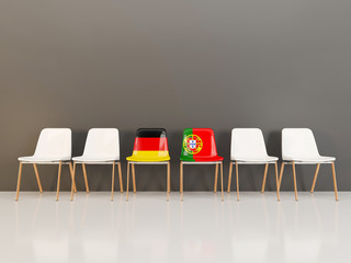 Chairs with flag of Germany and portugal in a row