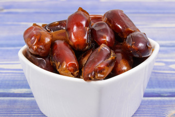 Heap of dates as source natural vitamins, minerals and dietary fiber, healthy nutrition