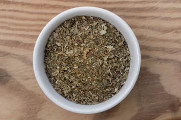 dried lovage leaves in small bowl