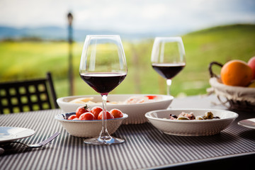 lunch with a view - table against beautiful landscape in Tuscany