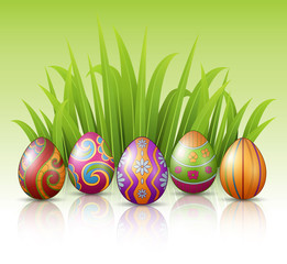 Decorated Easter eggs with green grass background