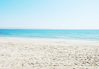 Fototapeta na wymiar Beach and sea in bright sunlight