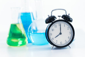 8 o'clock retro clock with Science Chemical medical research lab background