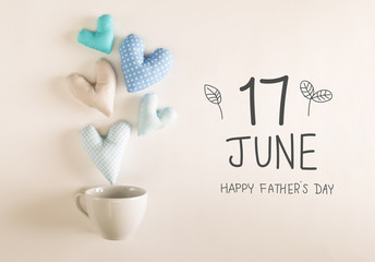 Father's Day message with blue heart cushions coming out of a coffee cup