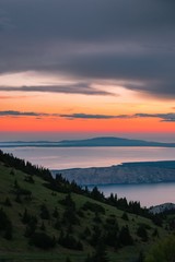 Landscape view of Croatian islands in the Adriatic sea from the Velebit mountain during a beautiful colorful sunset, national park Velebit in Croatia