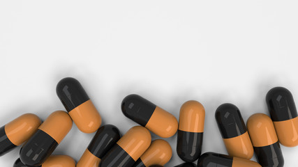 Pile of black and orange medicine capsules