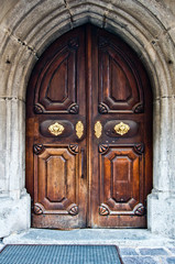 antique wooden door with handle and decorations