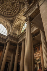 Pantheon inside view with high ceiling, columns, statues and paintings richly decorated in Paris....