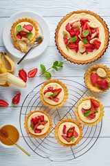 tartlets with strawberries on a table