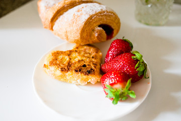 Bread with strawberries and cheese in the form of a heart