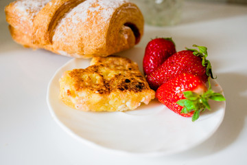 Baked pastry with cheesecakes on a white background