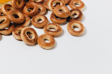 Pile of crispy cracknels in bowl isolated on white background