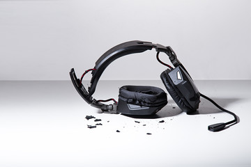 destroyed headphones on background.