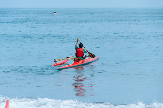 Kayaking. Man paddling a kayak.