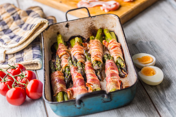 Tasty food bacon wrapped asparagus in frying pan
