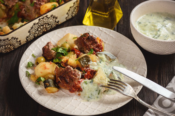 Kofte , beef meatballs, baked with vegetables.