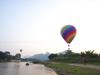 Multi Color and Colorful Balloon with a Blue Sky , Travel in the river city of Vang Viang City, Laos. 5th December, 2013.