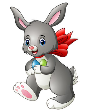 Cute cartoon rabbit carrying two easter eggs