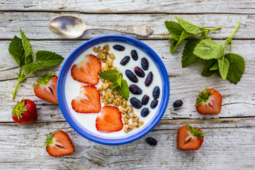A delicious and healthy breakfast of yogurt with fresh fruit. 