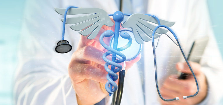Doctor holding a 3d redering medical cadaceus and stethoscope