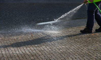 Wet cleaning of street.