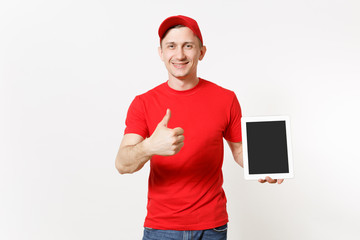 Delivery man in red uniform isolated on white background. Male in cap, t-shirt, jeans working as courier or dealer, holding tablet pc computer with blank empty screen. Copy space for advertisement.