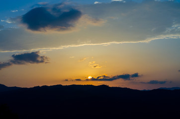 clouds sky sunset over mountains