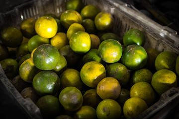 Fresh organic mandarins on the asian local market. Bali island.