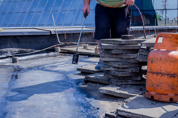 Roofing installation resin with propane blowtorch using a gas burner