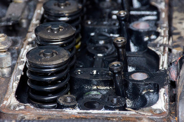 Obraz na płótnie Canvas Details of a dirty diesel engine under the hood of an car