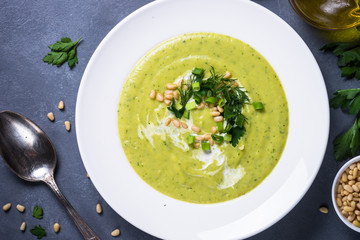 Cream soup with zucchini, herbs and cream.