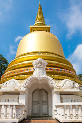 Fototapeta premium Stupa with golden dome in the Monastery of the Golden Temple Dambulla. The area is a world heritage site in Sri Lanka