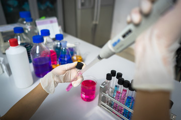 Scientist doing chemical test in laboratory