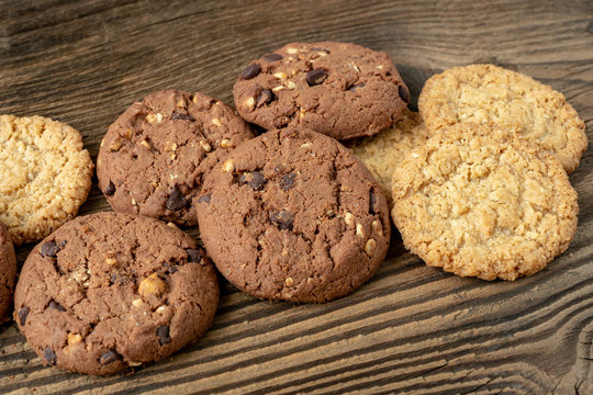 Various tasty cookies biscuits on wooden background