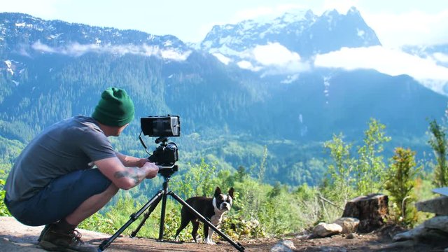 Camera Guy With Dog Filming Video Footage in Nature