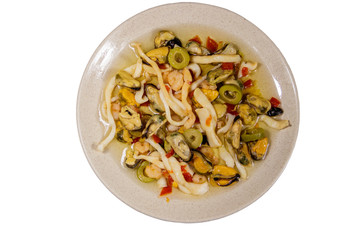Seafood salad with shrimp, squid and mussels isolated on white background