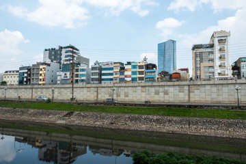 Fototapeta na wymiar Hanoi buildings with river on clear day in Cau Giay district