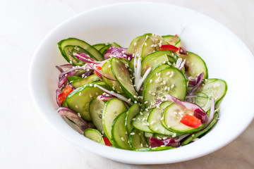 Asian Cucumber Salad with Sesame and served with Chopsticks.