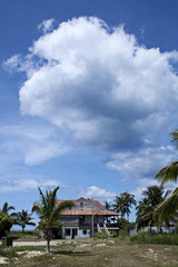 Fototapeta na wymiar Clouds over Cuban house