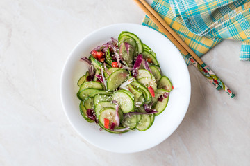 Asian Cucumber Salad with Sesame and served with Chopsticks.