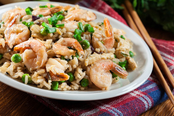 Fried rice with shrimp and vegetables served on a plate